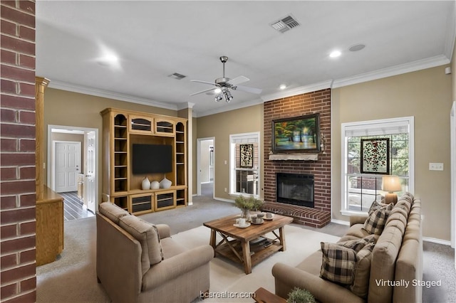 carpeted living room with a fireplace, ceiling fan, and crown molding