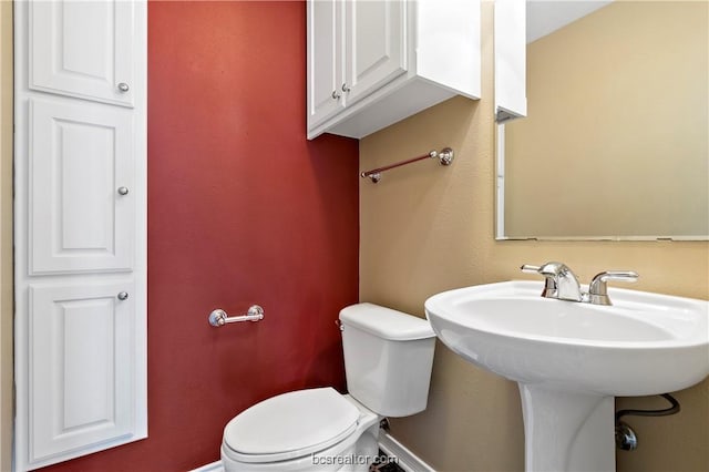 bathroom with toilet and sink