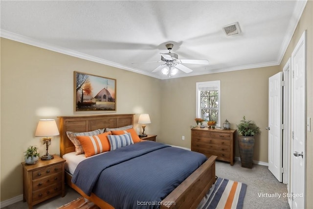 bedroom featuring ceiling fan, crown molding, light carpet, and a textured ceiling