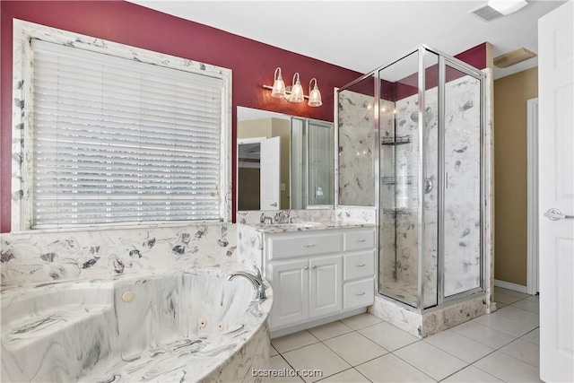 bathroom featuring shower with separate bathtub, vanity, and tile patterned floors