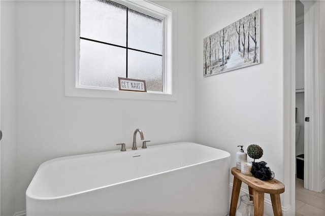 bathroom featuring a freestanding bath