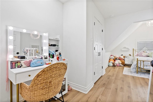 interior space featuring wood finished floors and baseboards