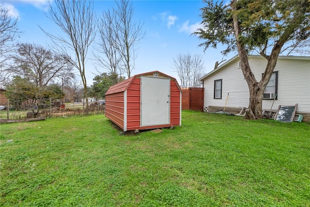 view of shed featuring fence