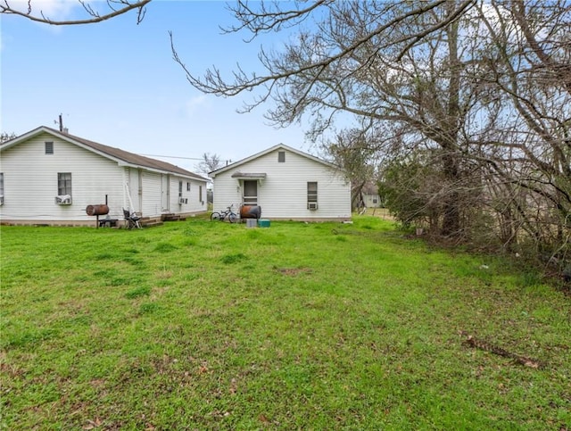 back of house with a yard