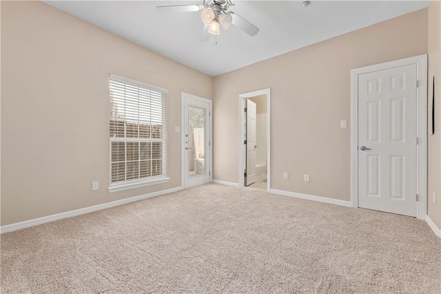 carpeted empty room with ceiling fan