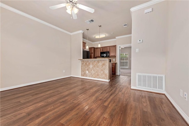 unfurnished living room with dark hardwood / wood-style flooring, ceiling fan, and crown molding