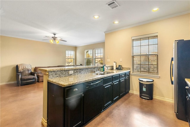 kitchen featuring dishwasher, sink, stainless steel refrigerator, and kitchen peninsula