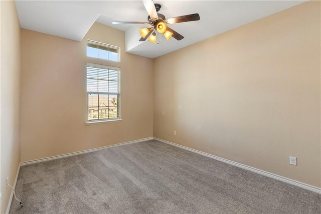 unfurnished room featuring light carpet and ceiling fan