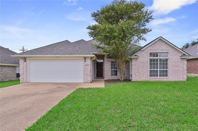 single story home featuring a garage and a front lawn