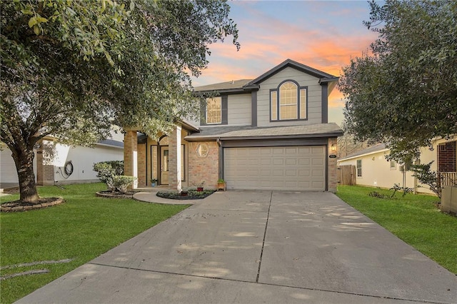 front of property featuring a garage and a lawn