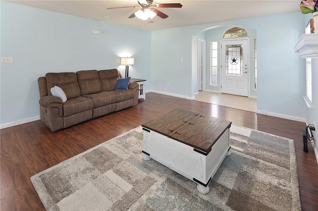 living room with hardwood / wood-style flooring and ceiling fan