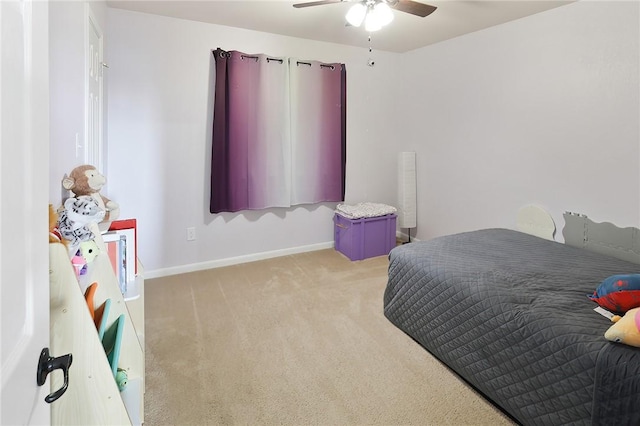 bedroom with ceiling fan and light colored carpet