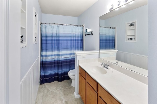 bathroom with vanity, tile patterned flooring, toilet, and a shower with shower curtain