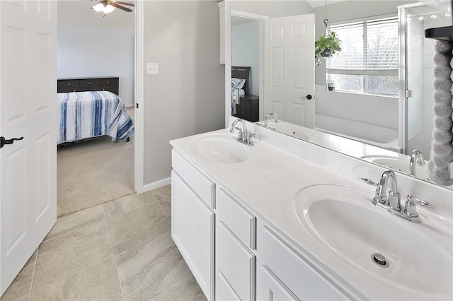 bathroom with ceiling fan, vanity, and tile patterned floors