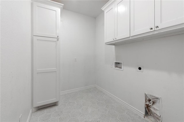 laundry area with cabinets, electric dryer hookup, and washer hookup