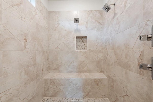 bathroom with tiled shower