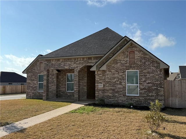 front facade with a front lawn