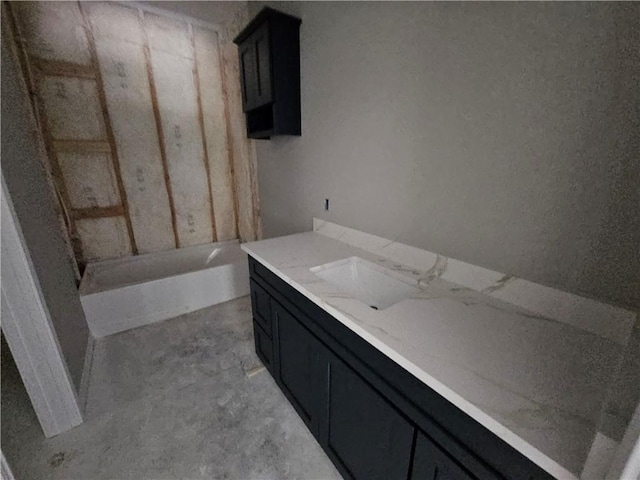 1112 Justine, Bryan, TX 77803 - bathroom with vanity, a bathtub, and concrete flooring