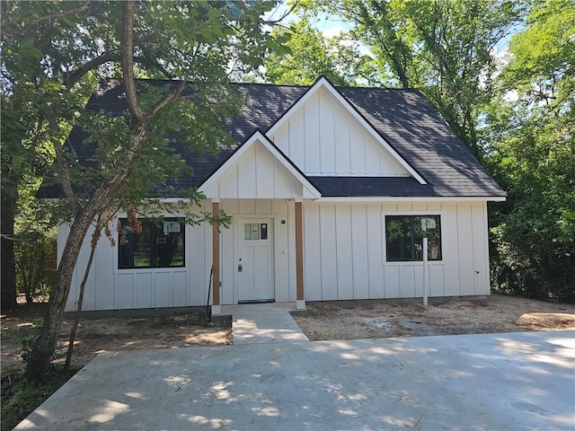 1112 Justine, Bryan, TX 77803 - modern farmhouse featuring roof with shingles and board and batten siding