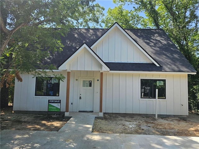 1112 Justine, Bryan, TX 77803 - modern inspired farmhouse featuring roof with shingles and board and batten siding