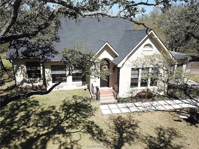 view of front of home with a front yard