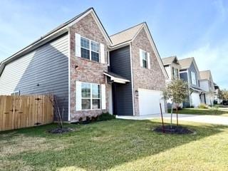 2126 Mountain Wind Loop, Bryan, TX 77807 - traditional home featuring an attached garage and concrete driveway