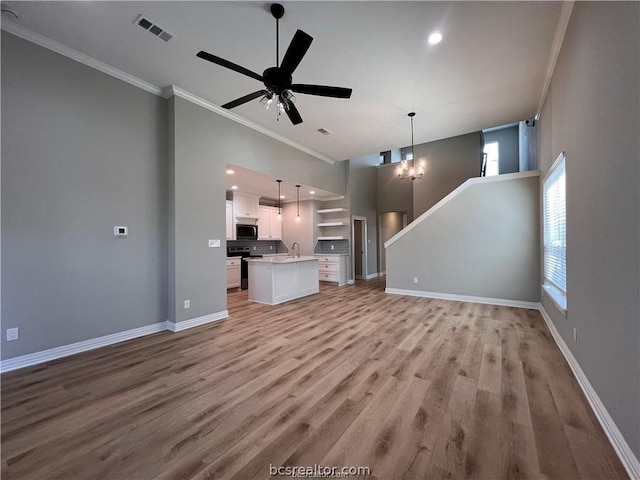 unfurnished living room with crown molding, light hardwood / wood-style flooring, ceiling fan with notable chandelier, and sink