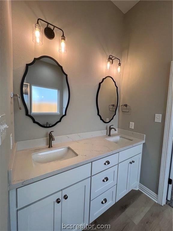 bathroom with vanity and hardwood / wood-style flooring