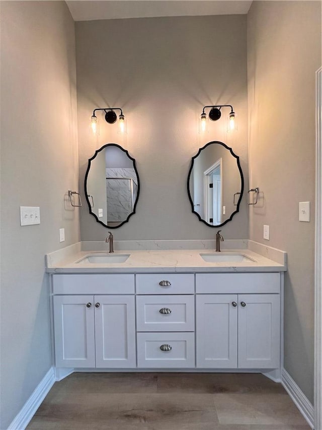 bathroom featuring vanity and wood-type flooring