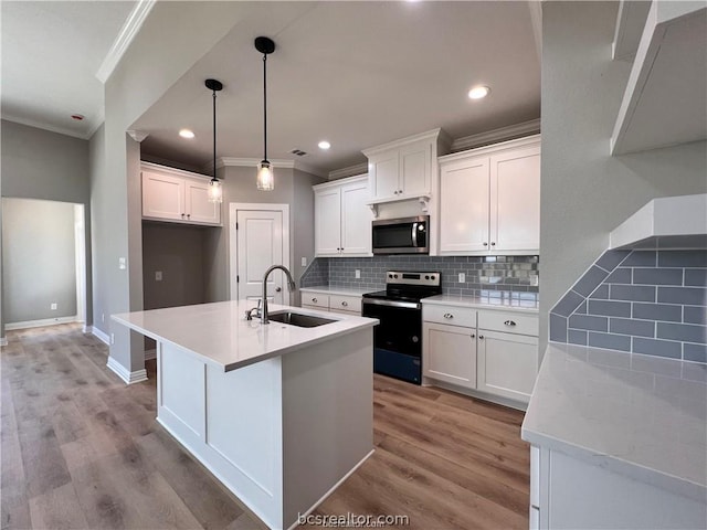 2126 Mountain Wind Loop, Bryan, TX 77807 - kitchen featuring stainless steel appliances, ornamental molding, light wood-type flooring, decorative backsplash, and light countertops
