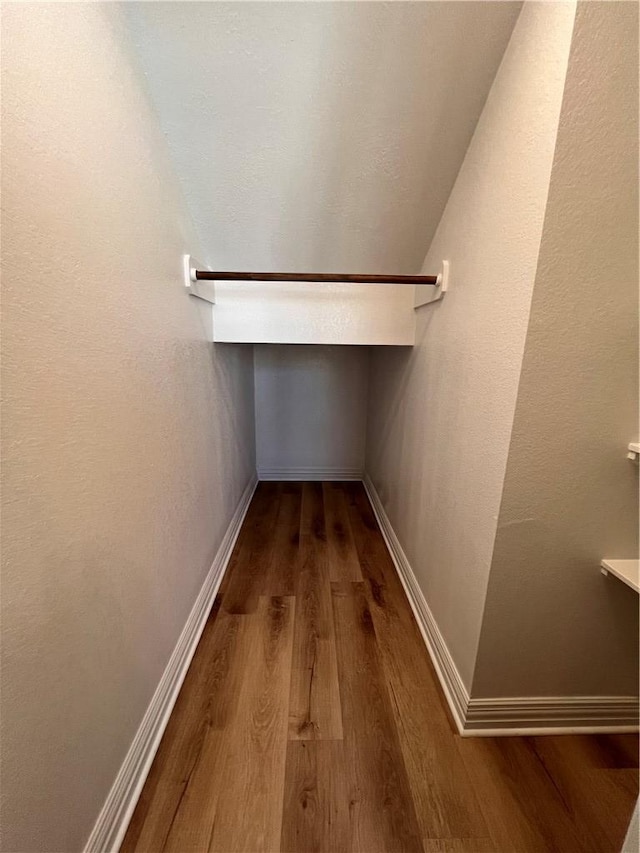2126 Mountain Wind Loop, Bryan, TX 77807 - walk in closet featuring wood finished floors and lofted ceiling