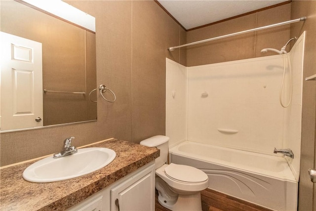 full bathroom with ornamental molding, shower / tub combination, vanity, and toilet