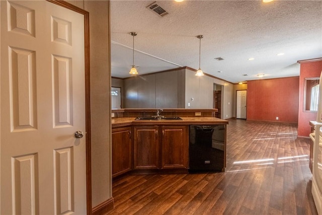 kitchen with black dishwasher, visible vents, dark wood finished floors, open floor plan, and a sink