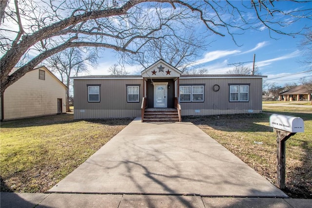 view of front of home with a front lawn and crawl space