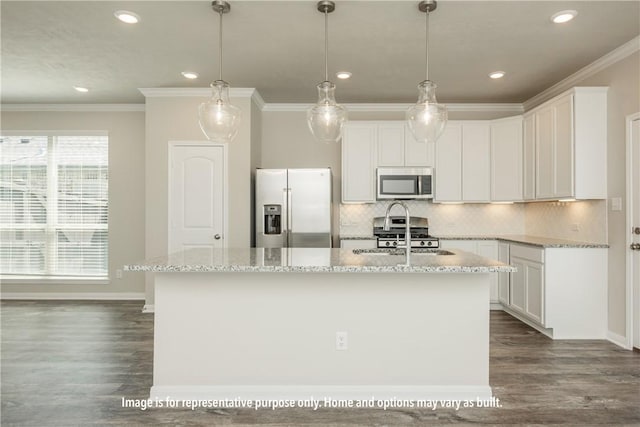 kitchen featuring hanging light fixtures, dark hardwood / wood-style floors, an island with sink, white cabinets, and appliances with stainless steel finishes