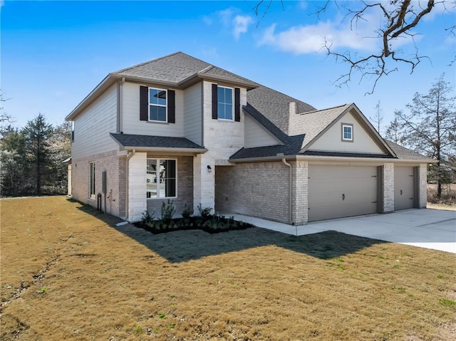 view of front of house with a garage and a front lawn