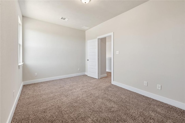 view of carpeted spare room