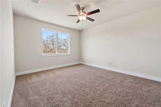 empty room with ceiling fan and carpet flooring