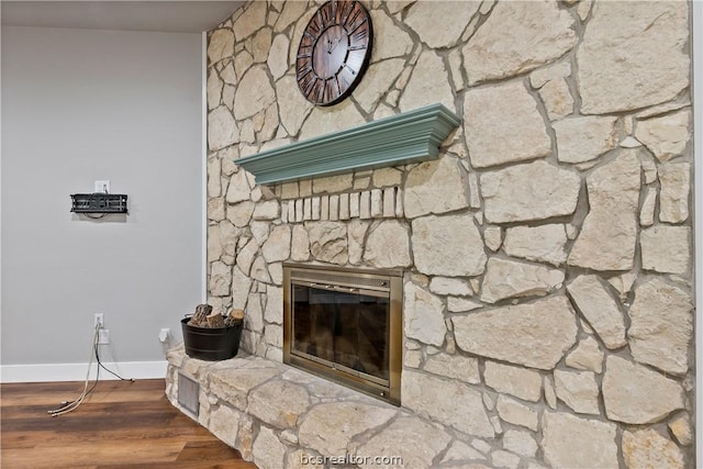 room details featuring wood-type flooring and a fireplace