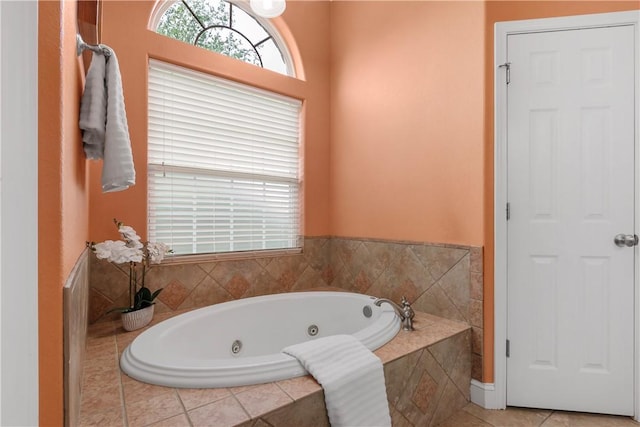 full bathroom featuring tile patterned floors and a jetted tub