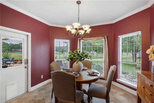 dining area featuring a chandelier, baseboards, ornamental molding, and light tile patterned flooring