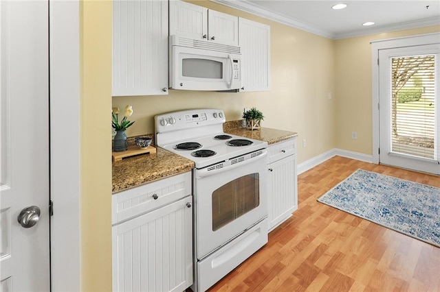 kitchen with white appliances, light stone countertops, ornamental molding, white cabinetry, and light wood-type flooring