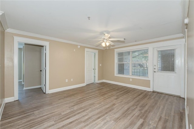 unfurnished room featuring ceiling fan, crown molding, and light hardwood / wood-style flooring