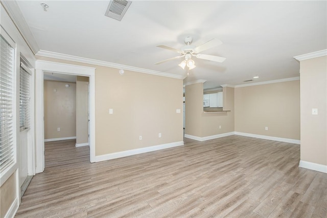 empty room featuring crown molding, light hardwood / wood-style flooring, and ceiling fan