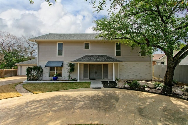 front facade with a garage and covered porch