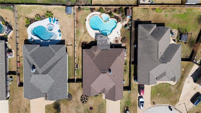 french provincial home featuring an attached garage, brick siding, fence, driveway, and a front yard