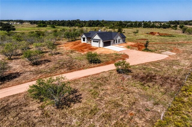 birds eye view of property with a rural view