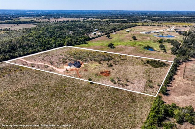 birds eye view of property with a rural view