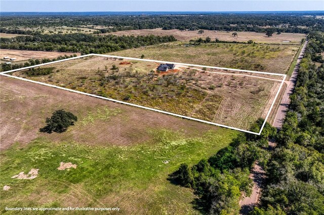 birds eye view of property featuring a rural view