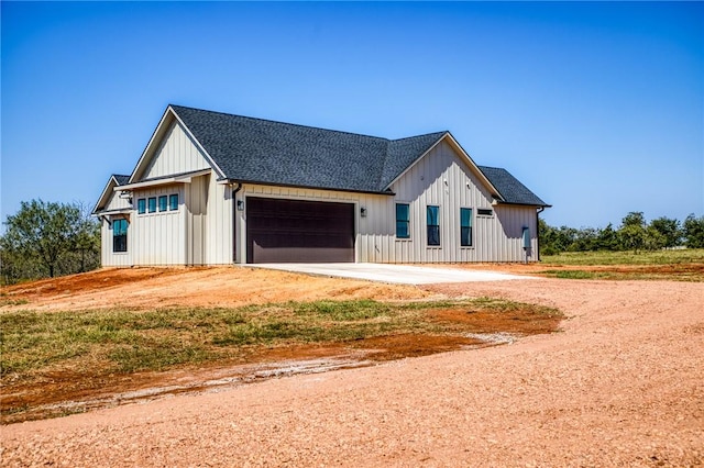 modern farmhouse style home with a garage